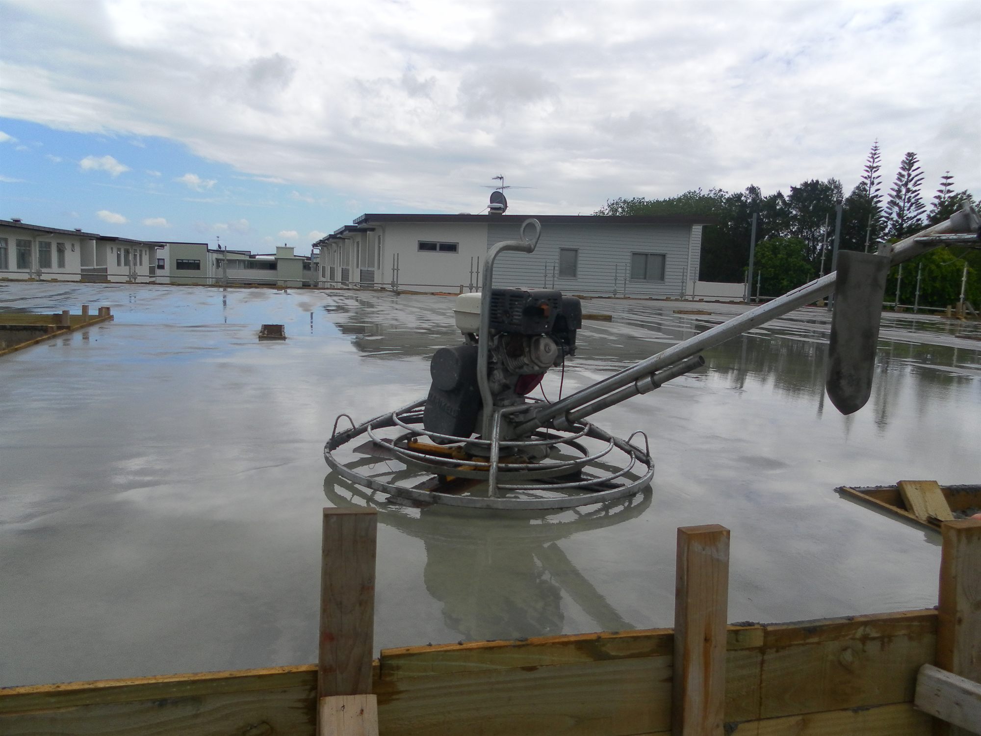 Fresh concrete slab being finished