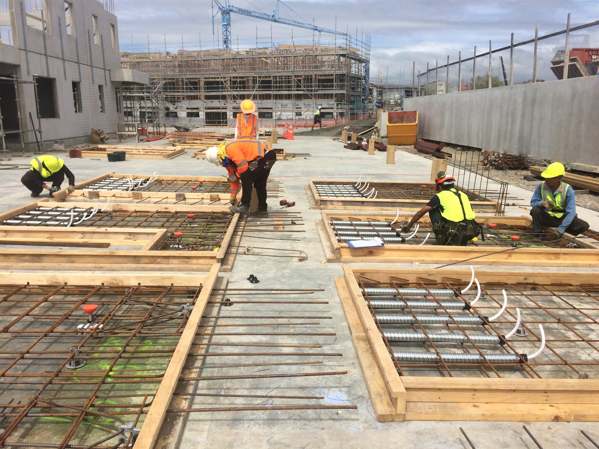 Workers preparing slab formwork